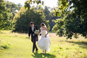 bride and groom walking in the country